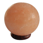 Spherical Himalayan salt lamp, on a wooden base